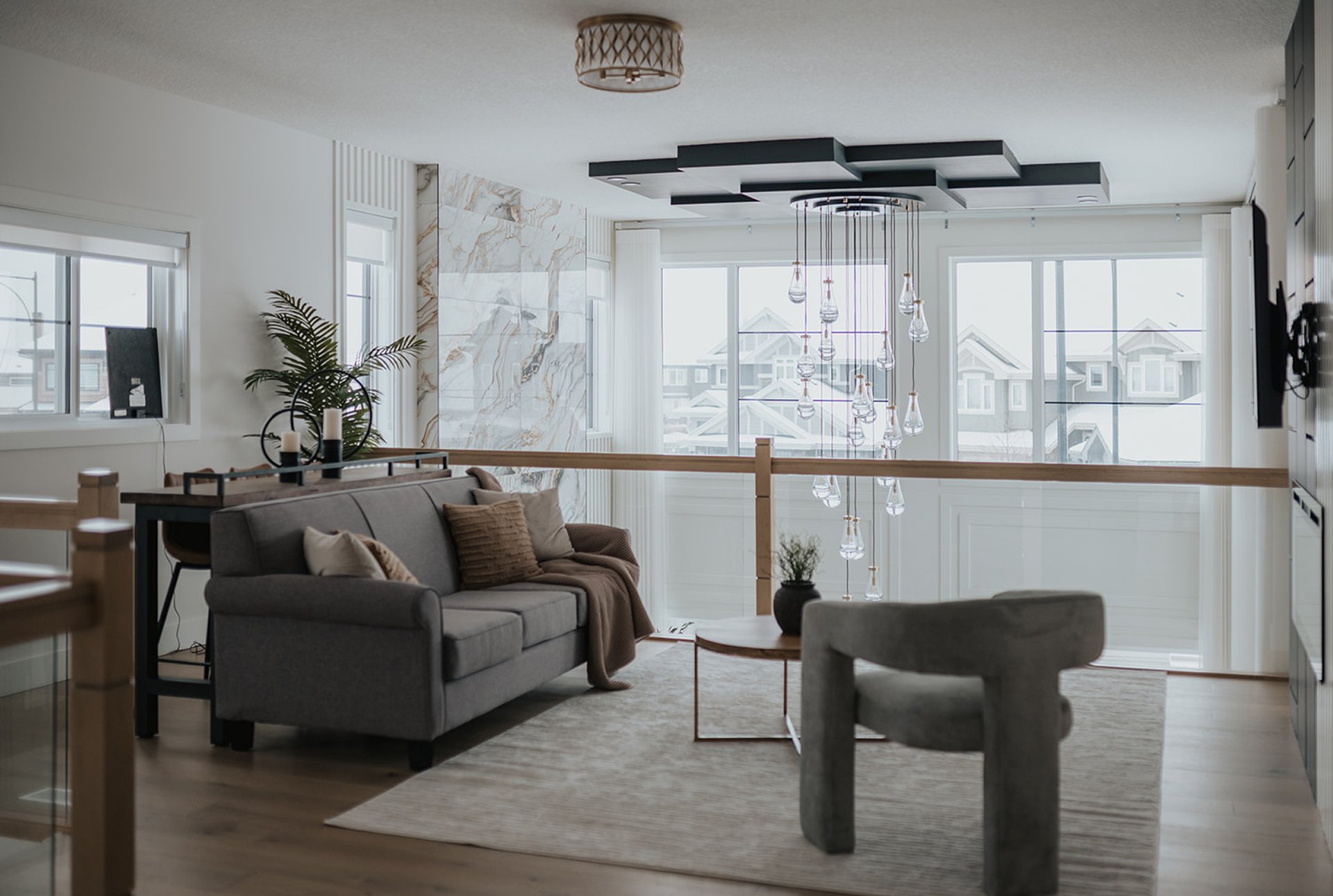 Custom drapery and roller shades layered in an Edmonton family room by Novo Blinds