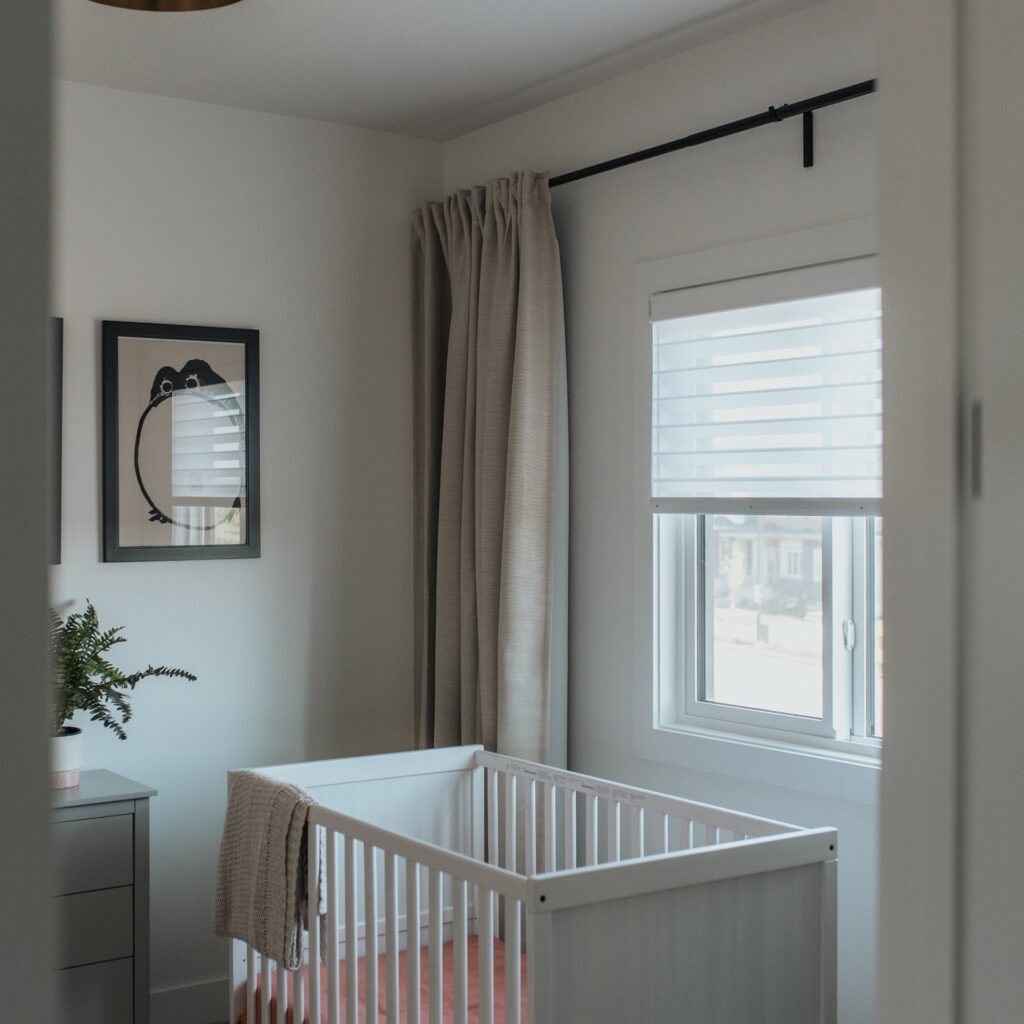 Living room with custom roller shades by Novo Blinds in a Sherwood Park home