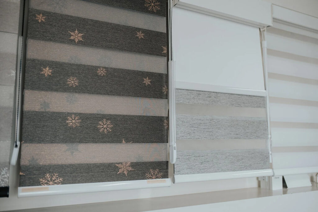 Dual fabric blinds by Novo Blinds — zebra-style sheer and solid bands for adjustable light and privacy