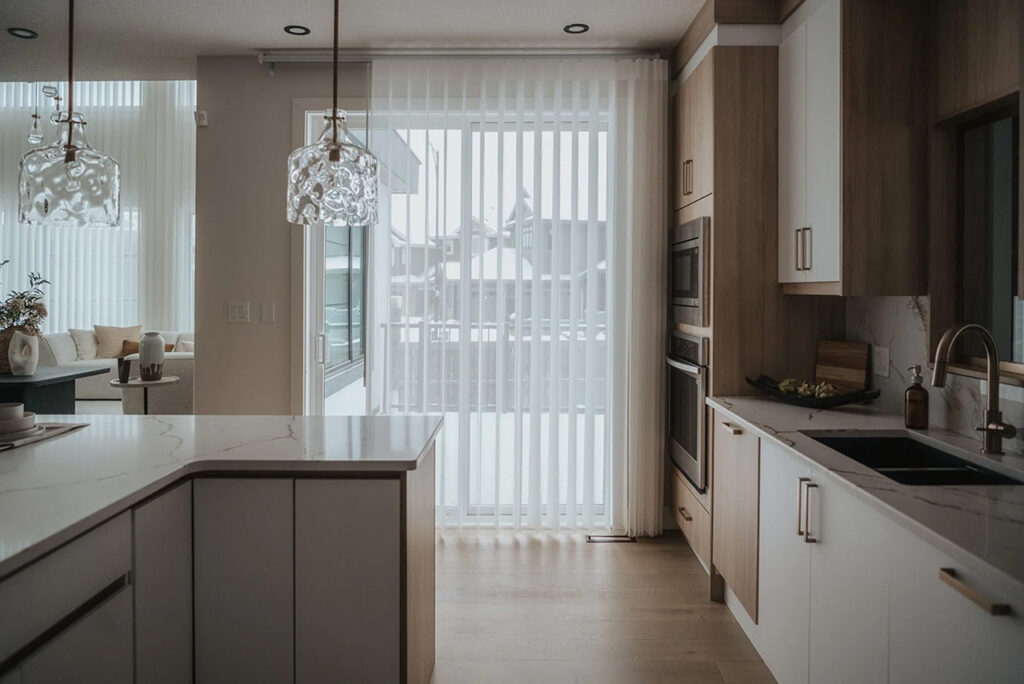 Vertical sheer curtains by Novo Blinds — elegant layered drapes for patio doors and large Edmonton windows