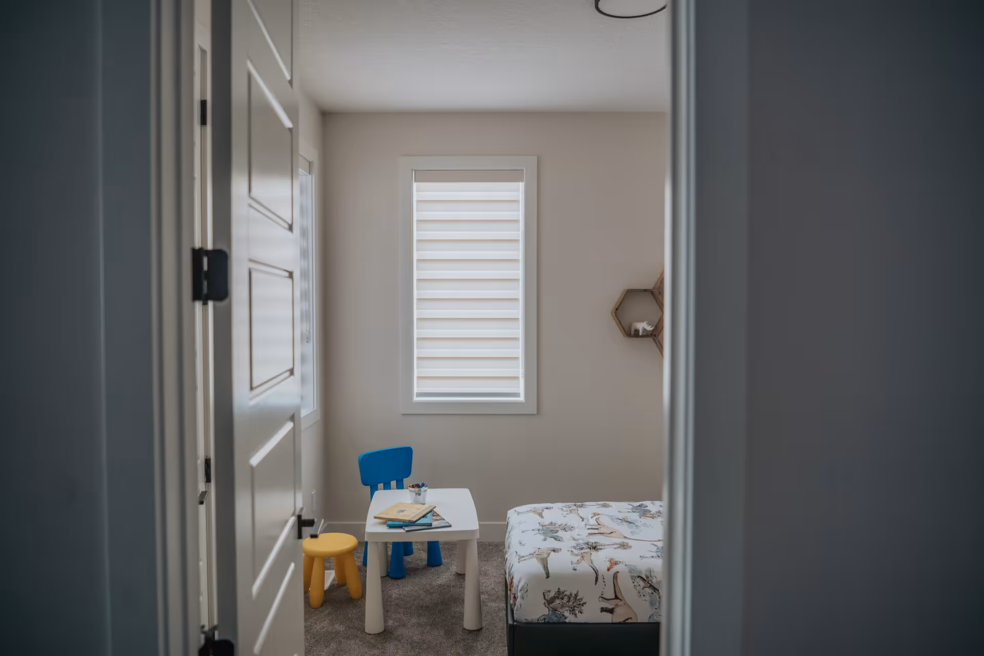 Affordable roller shades in an Edmonton playroom