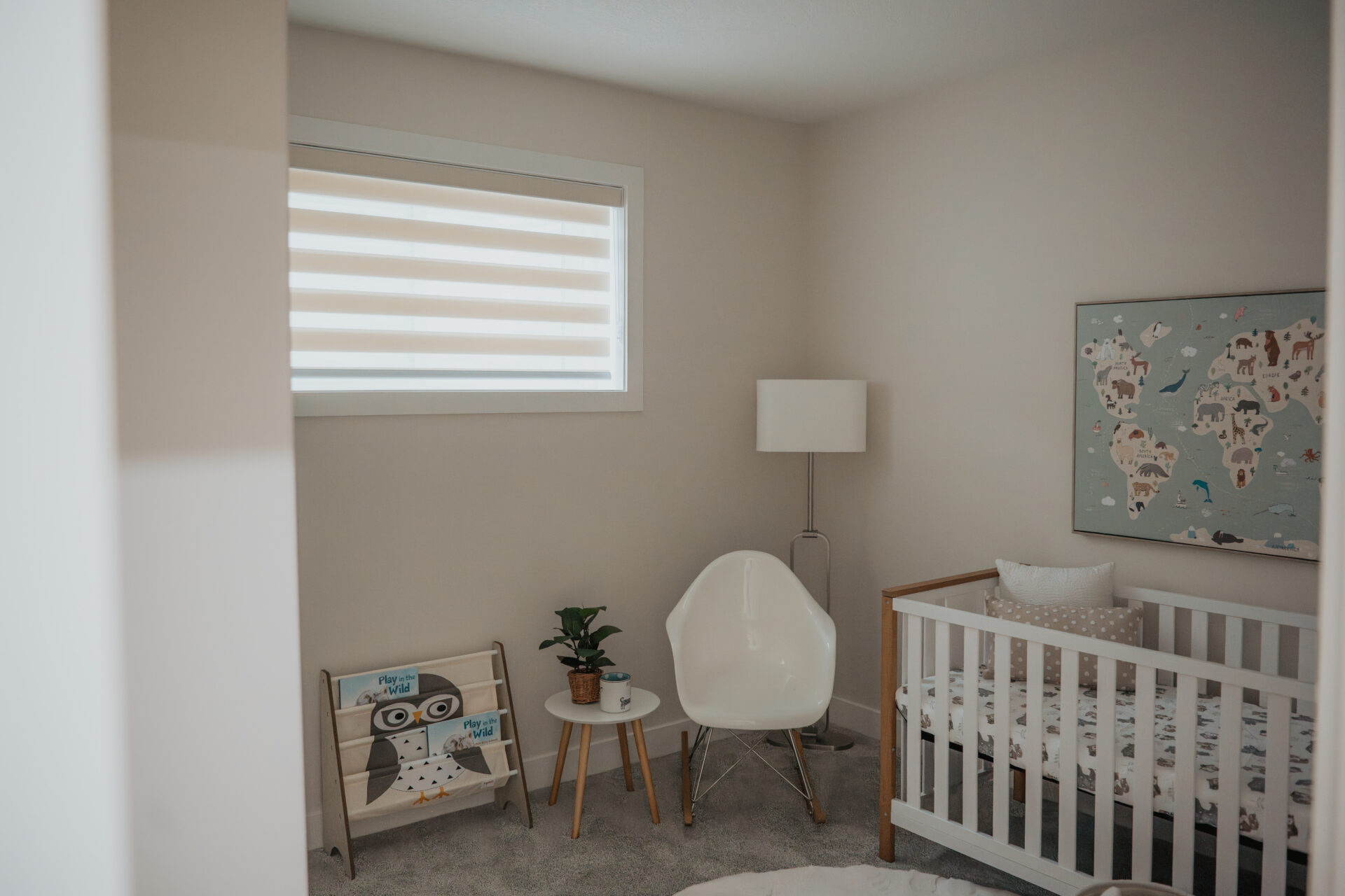 Residential zebra blinds providing soft light control in an Edmonton nursery