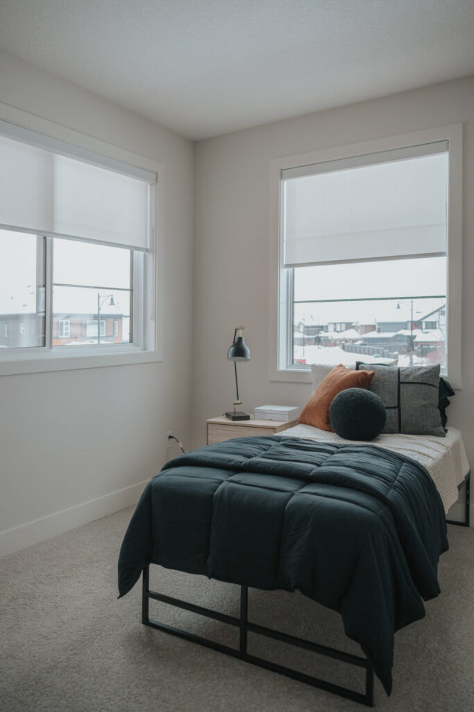Grey residential roller blinds for a modern bedroom in an Edmonton home