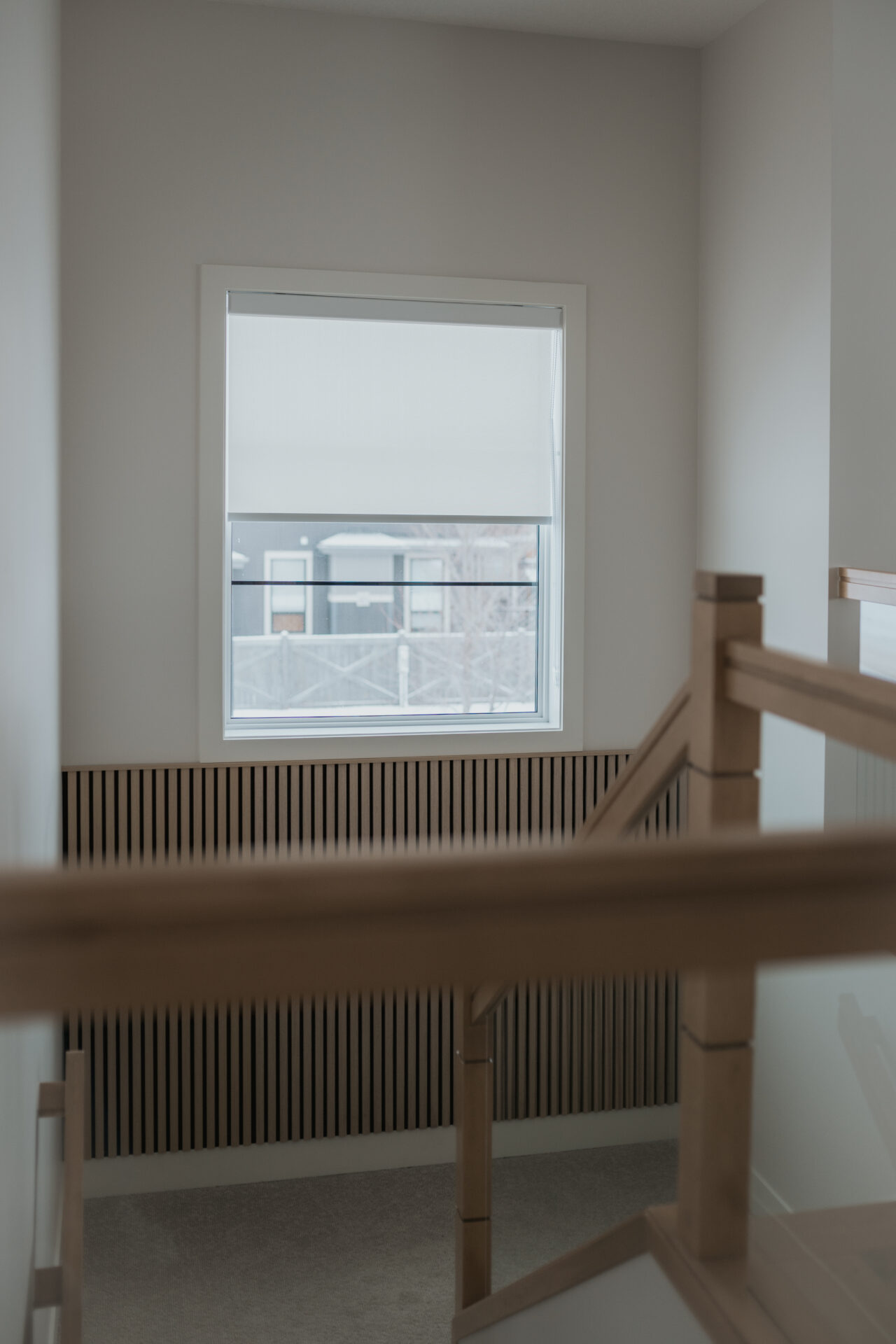 Residential privacy blinds for a staircase window in an Edmonton home