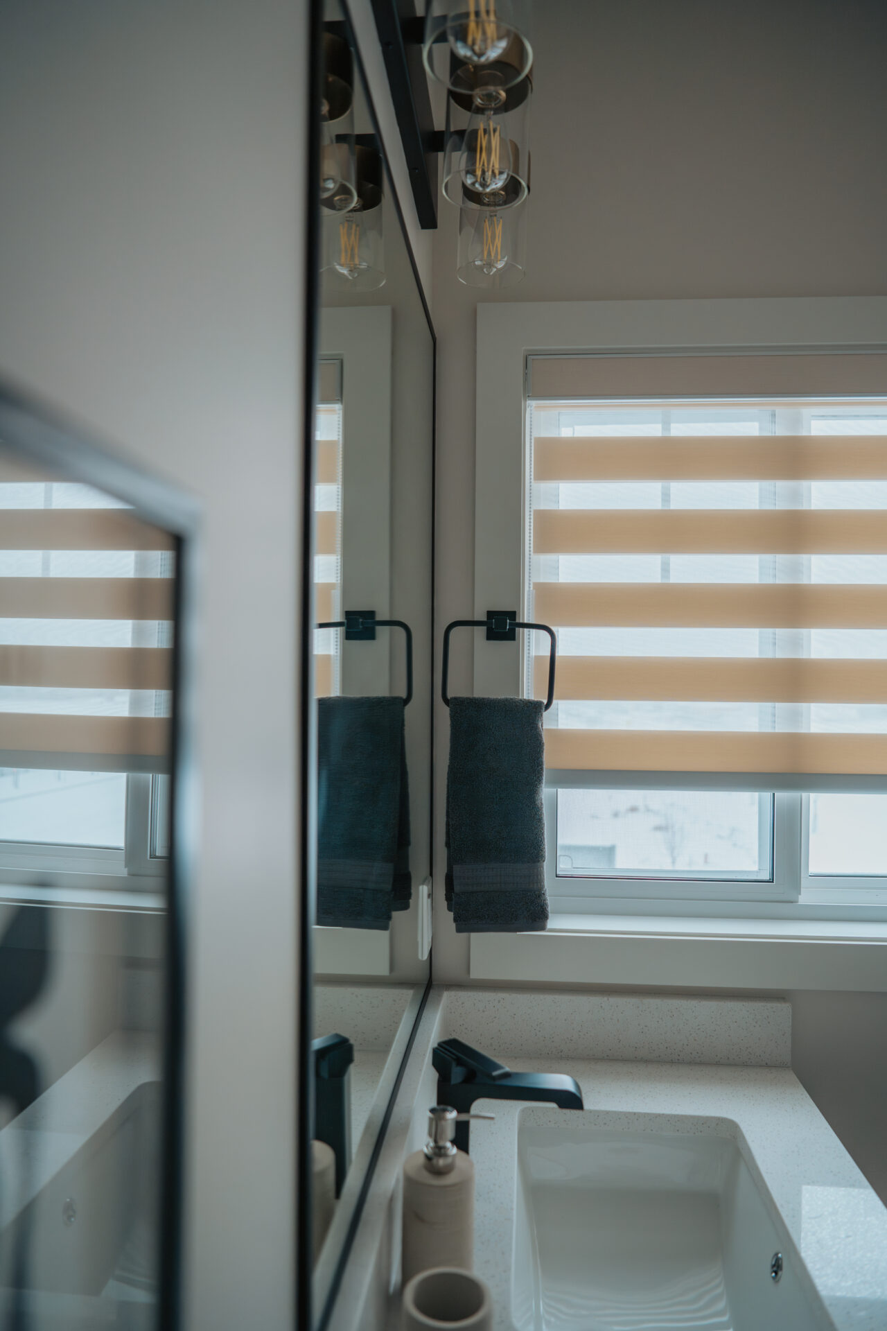 Functional residential zebra blinds installed in an Edmonton home utility space