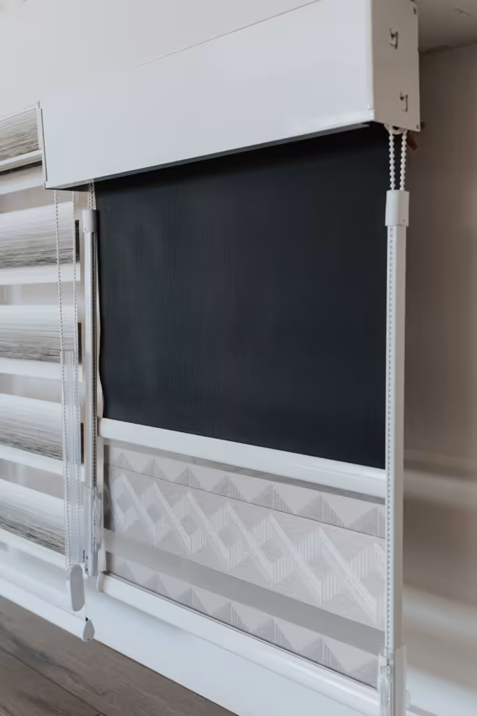 Tall narrow window with custom roller shade in an Edmonton home
