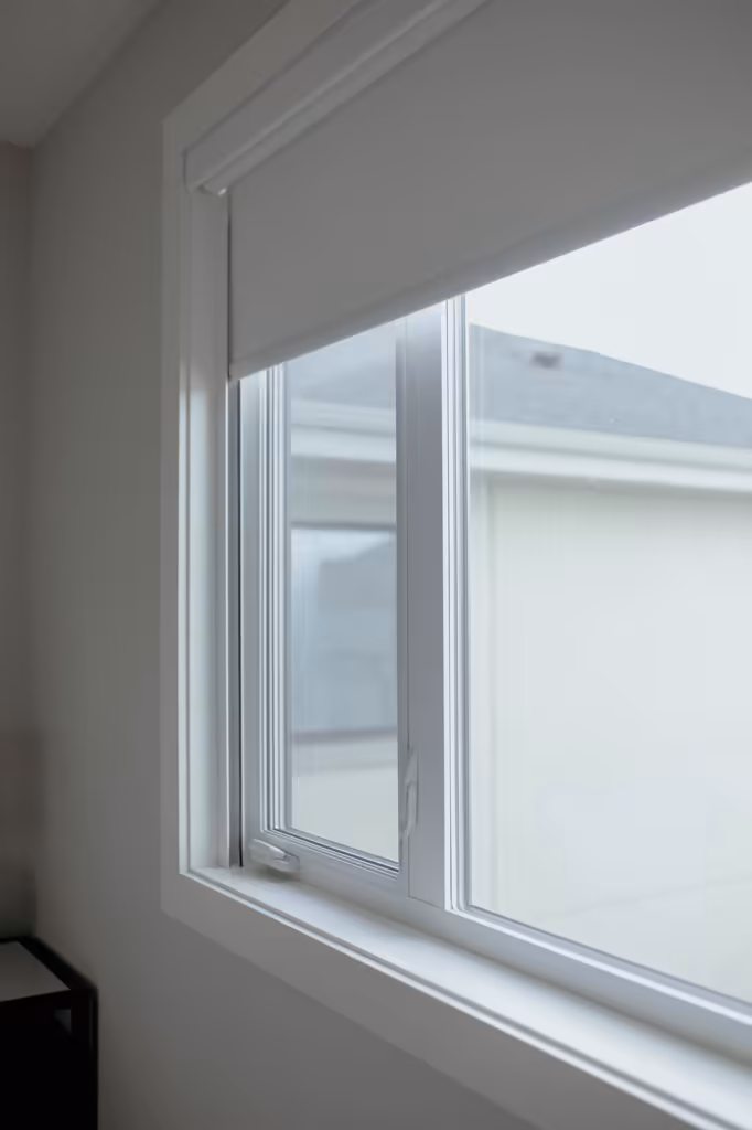 Custom roller blinds installed in an Edmonton home office for glare control