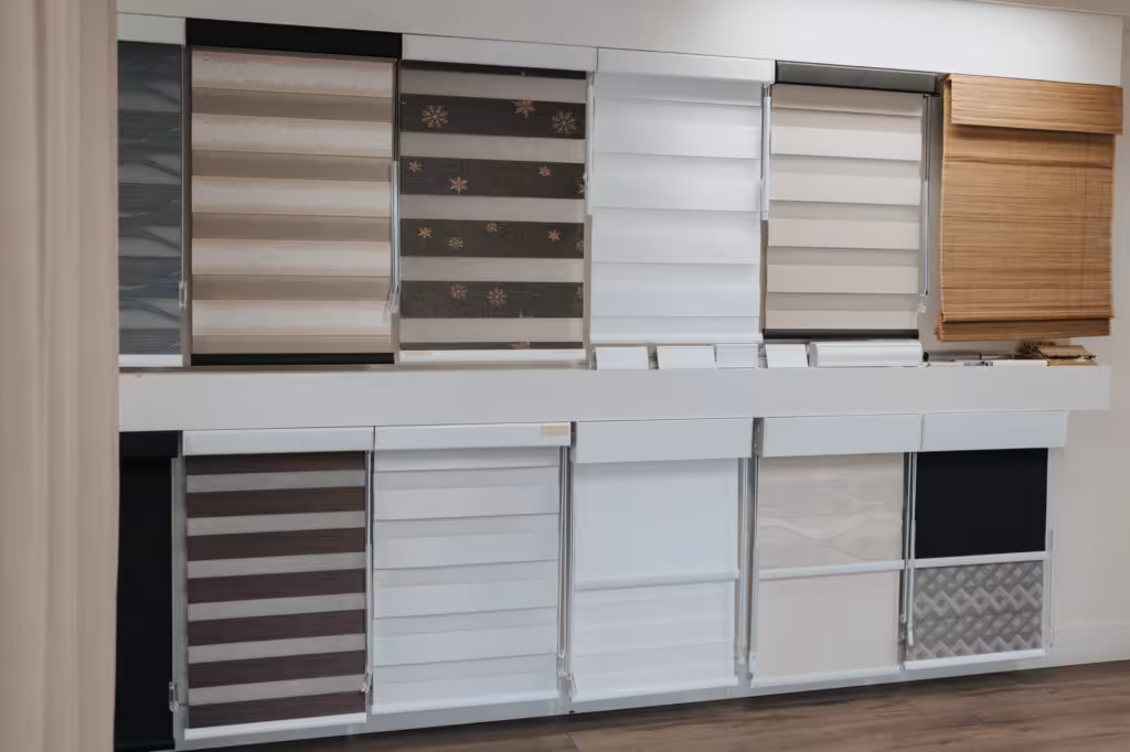 A range of zebra, roller and Roman blinds on display in the Novo Blinds showroom