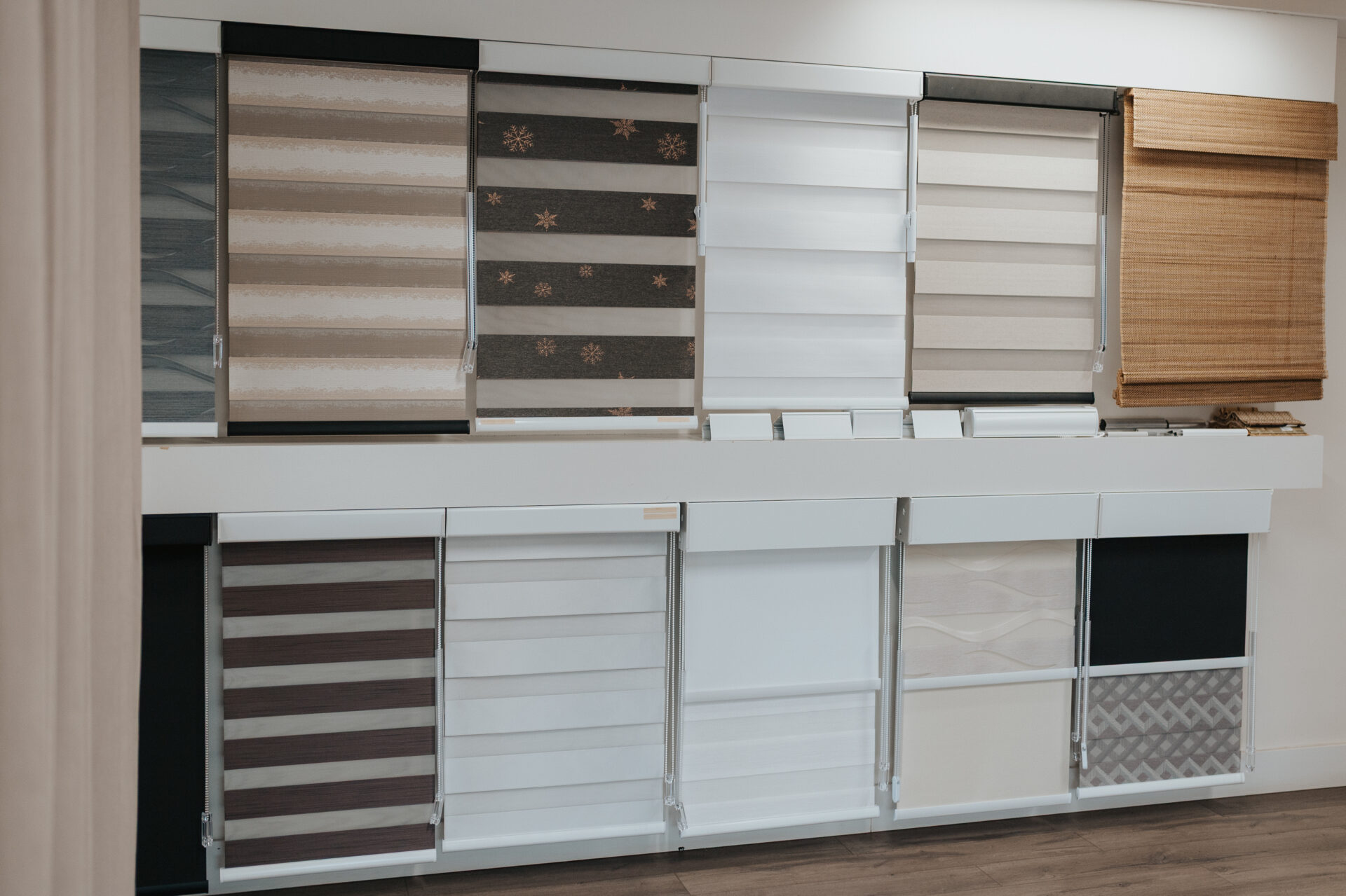 A range of zebra, roller and Roman blinds on display in the Novo Blinds showroom